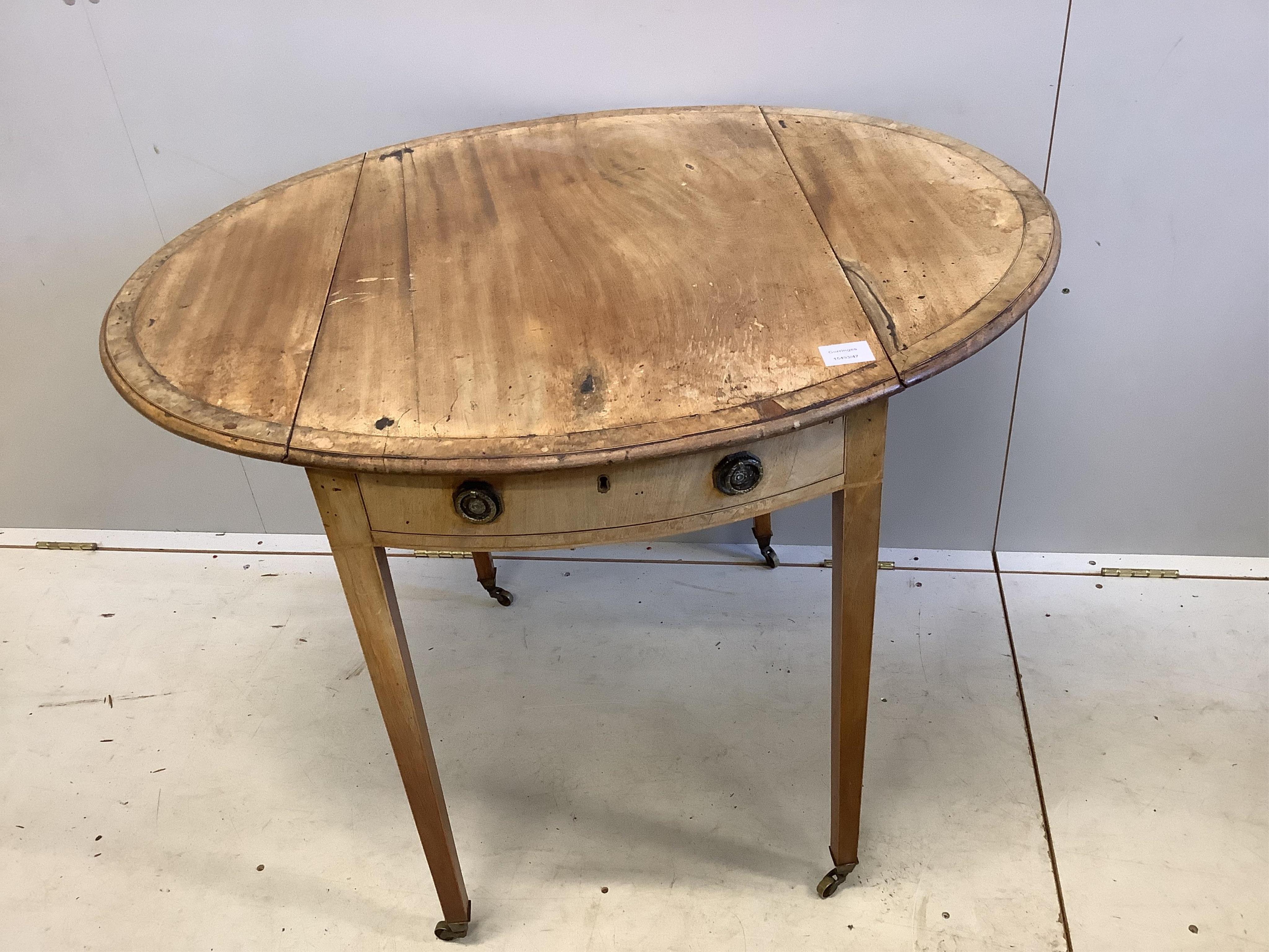 A George III banded mahogany oval topped Pembroke table, width 51cm, depth 76cm, height 73cm. Condition - poor